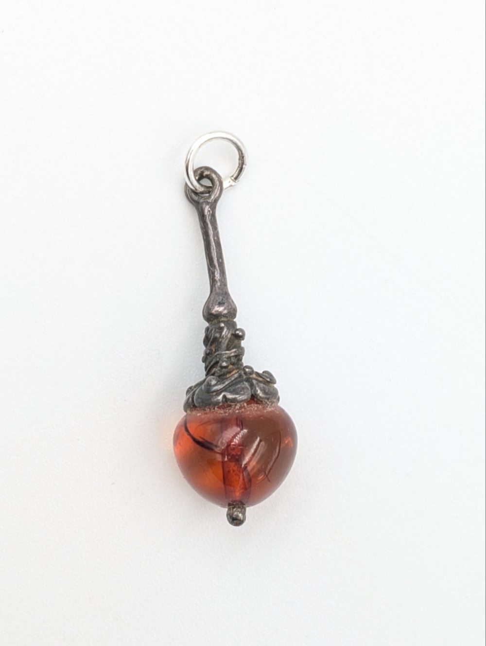 Antique Victorian cognac amber ball pendant oxidized sterling silver ornate